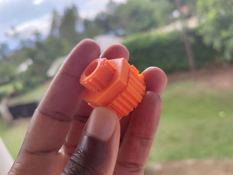 Hand holding a 3D printed garden hose adaptor