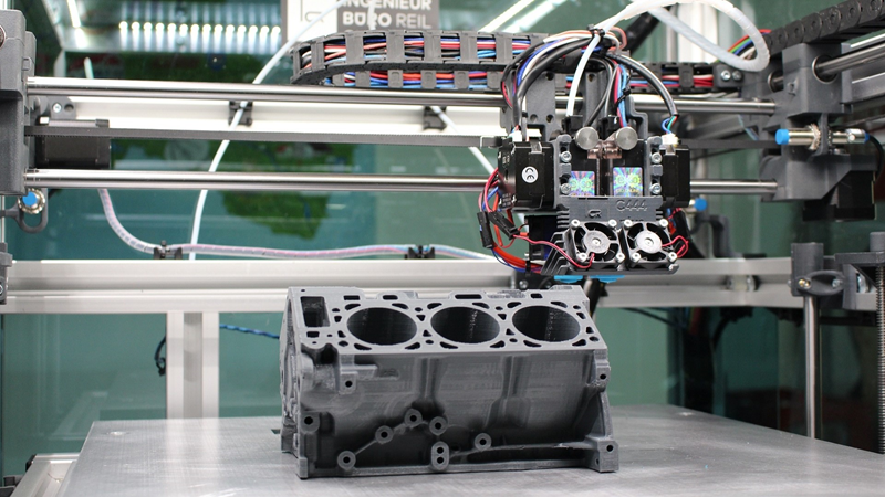 Model engine block being printed using 3D printer